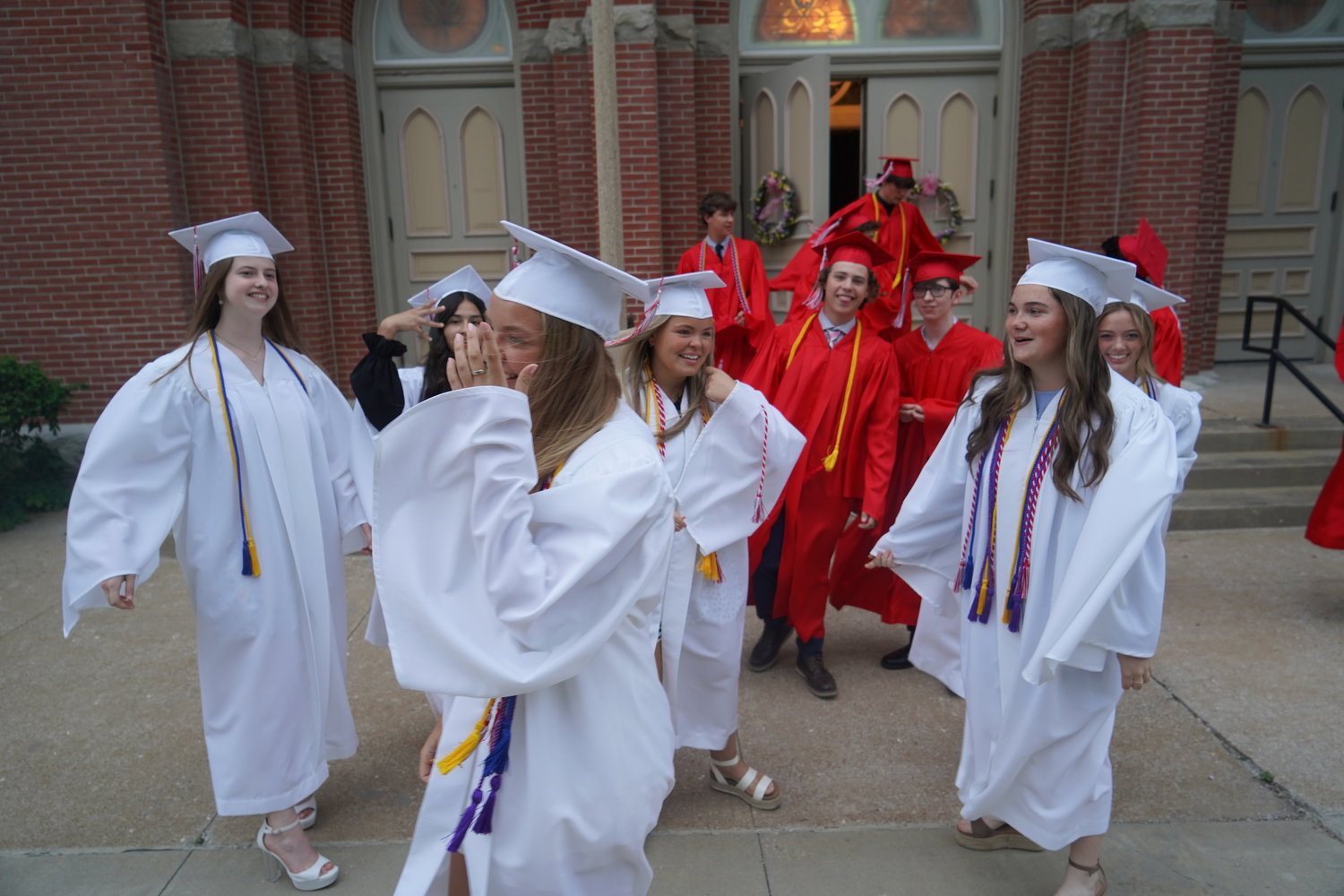 Members of Sacred Heart High School’s Class of 2022 celebrate outside the Sacred Heart Chapel in Sedalia following their Baccalaureate Mass on May 20.
